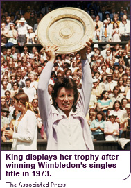 King displays her trophy after winning Wimbledon's single's title in 1973.