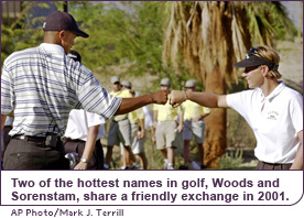 Two of the hottest names in golf, Sorenstam and Woods, share a friendly exchange in 2001.