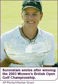 The golfer holds her trophy for winning the 2003 Women’s British Open Golf Championship.